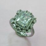 CZ RING WITH A SQUARE SHAPE CENTER STONE